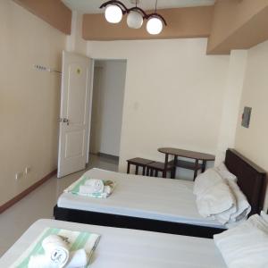 Postel nebo postele na pokoji v ubytování AAM Transient and Guest House