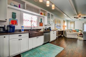 a kitchen with white cabinets and a sink at The Rookery III Unit 7024 Cottage in Gulf Shores