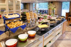 a buffet line with many different types of food at Day Nice Hotel Tokyo in Tokyo