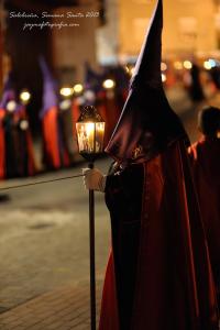 a person dressed in a costume holding a lantern at Hostal Jayma in Salobreña