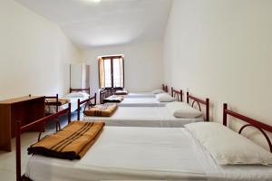 En eller flere senger på et rom på Ostello del Parco di Monte Cucco