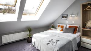 Posteľ alebo postele v izbe v ubytovaní Apartamenty Forma Tatrica