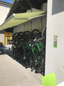 a bunch of bikes parked next to a building at Adhhoc Hotel in Naters