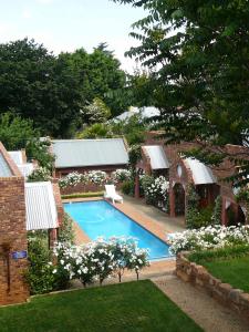 The swimming pool at or close to Van Dykshuis Guest House