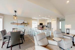 a kitchen and dining room with a table and chairs at Wapato Point Lakeview in Manson