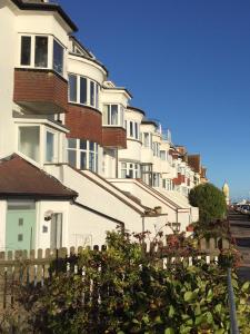 a row of houses on the side of a street at SeaScape in Bexhill