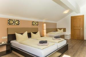 Letto o letti in una camera di T3 Gasthof Spullersee