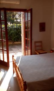 Ένα ή περισσότερα κρεβάτια σε δωμάτιο στο Vasiliki Apartments