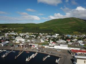 an aerial view of a harbor with boats in the water at Askja Apartment in Húsavík