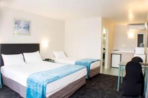 Postel nebo postele na pokoji v ubytování Rayland Motel + 30 fotografií