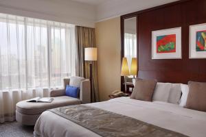 Voodi või voodid majutusasutuse Hotel Royal Macau toas