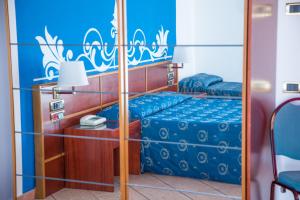 Postel nebo postele na pokoji v ubytování Assinos Palace Hotel