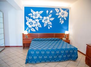 Postel nebo postele na pokoji v ubytování Assinos Palace Hotel