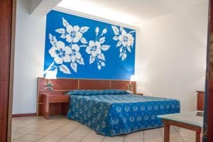 Postel nebo postele na pokoji v ubytování Assinos Palace Hotel