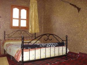 Rúm í herbergi á Auberge Gitelkst