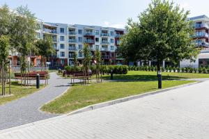 Vonkajšia záhrada v ubytovaní Apartamenty Polanki Park BASEN, SAUNA & SIŁOWNIA by Noclegi Renters