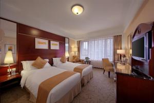 Televiisor ja/või meelelahutuskeskus majutusasutuses Hotel Royal Macau