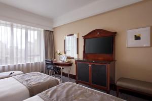 Voodi või voodid majutusasutuse Hotel Royal Macau toas