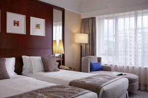 Voodi või voodid majutusasutuse Hotel Royal Macau toas