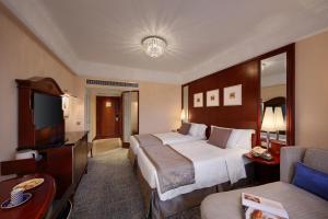 Voodi või voodid majutusasutuse Hotel Royal Macau toas