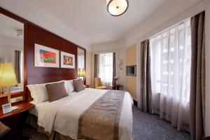 Voodi või voodid majutusasutuse Hotel Royal Macau toas
