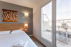 Ένα ή περισσότερα κρεβάτια σε δωμάτιο στο Residhotel Le Grand Prado