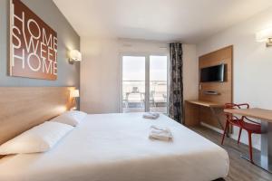 Ένα ή περισσότερα κρεβάτια σε δωμάτιο στο Residhotel Le Grand Prado