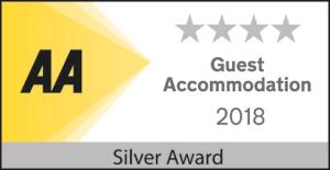 a sign with the words guest association and silver award at The Penellen guest accommodation room only in Hayle