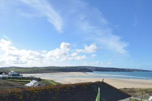 a view of a beach and the ocean at The Penellen guest accommodation room only in Hayle
