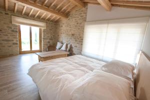Ліжко або ліжка в номері Gaiattone Eco Resort