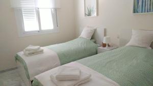 A bed or beds in a room at Urb. Valle Romano Capitolio 11B-C