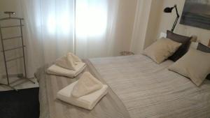 A bed or beds in a room at Urb. Valle Romano Capitolio 11B-C