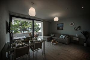 a living room with a table and a couch at Villa Amoretta - Pisak (Omiš) in Pisak