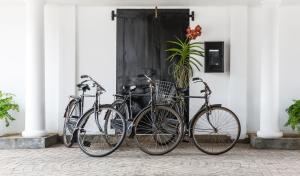 a group of bikes parked next to a building at Fox Jaffna by Fox Resorts - Boutique Heritage Luxury in Jaffna