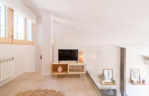 Televízia a/alebo spoločenská miestnosť v ubytovaní Casa Dolce Riera I - Sa Riera (Begur)