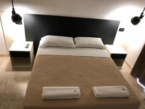 Postel nebo postele na pokoji v ubytování Albergo Milazzo Inn AiMori