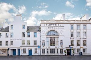 a white building with a sign for the salutation hotel at Salutation Hotel in Perth