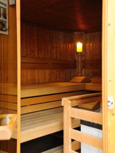a sauna with four beds in a wooden room at Burg Deutschlandsberg in Deutschlandsberg