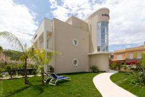 a house with a lawn in front of it at Hotel Nautilus in Cagliari
