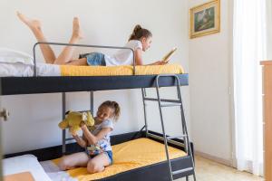 Postel nebo postele na pokoji v ubytování Hotel Garisenda