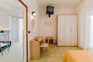 Postel nebo postele na pokoji v ubytování Hotel Garisenda