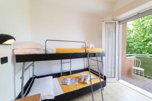 Postel nebo postele na pokoji v ubytování Hotel Garisenda