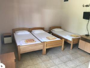 Postel nebo postele na pokoji v ubytování Apartmani Tomovic