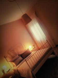 Postel nebo postele na pokoji v ubytování B&B L'angolo fiorito + 37 fotografií