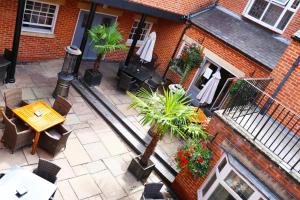 an overhead view of a patio with a table and chairs at The Lion Hotel in Belper