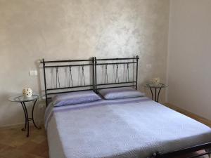 Postel nebo postele na pokoji v ubytování B&B Il Palazzotto del Caveoso