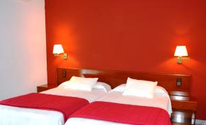 Postel nebo postele na pokoji v ubytování Hotel Venta de la Punta