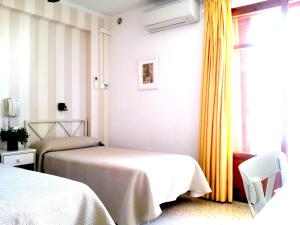 Postel nebo postele na pokoji v ubytování Hotel Tramontana