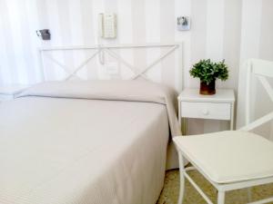 Postel nebo postele na pokoji v ubytování Hotel Tramontana