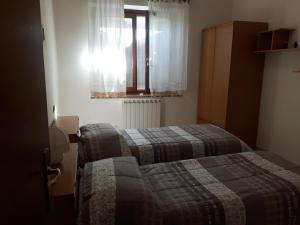 Postel nebo postele na pokoji v ubytování Agriturismo La Selva